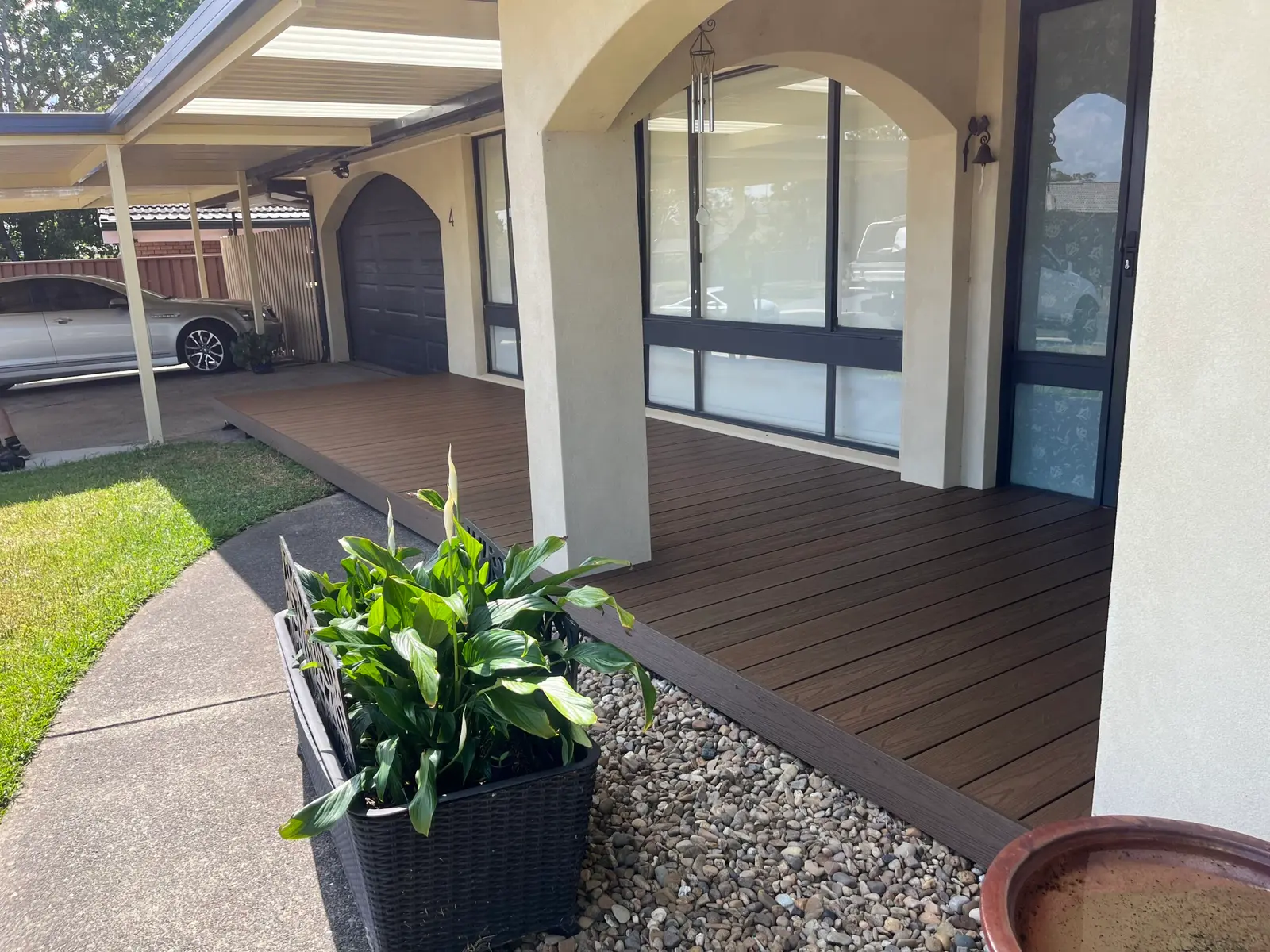 Flat-roof pergola over a paved courtyard